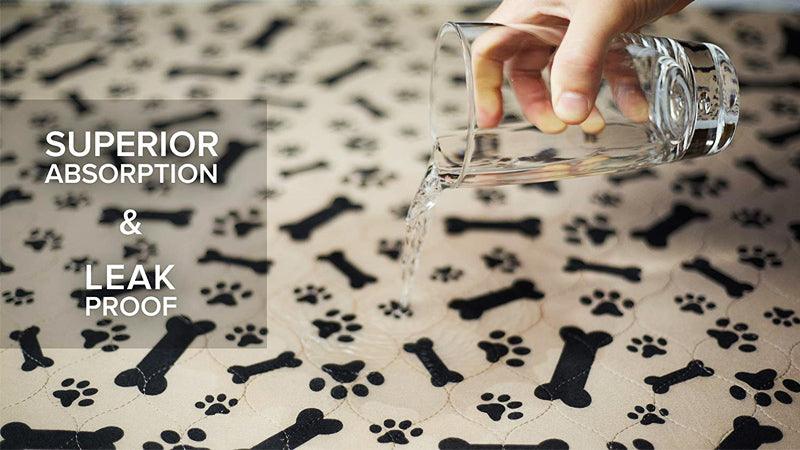 Water being poured out of a glass on a washable incontinence pad for dogs