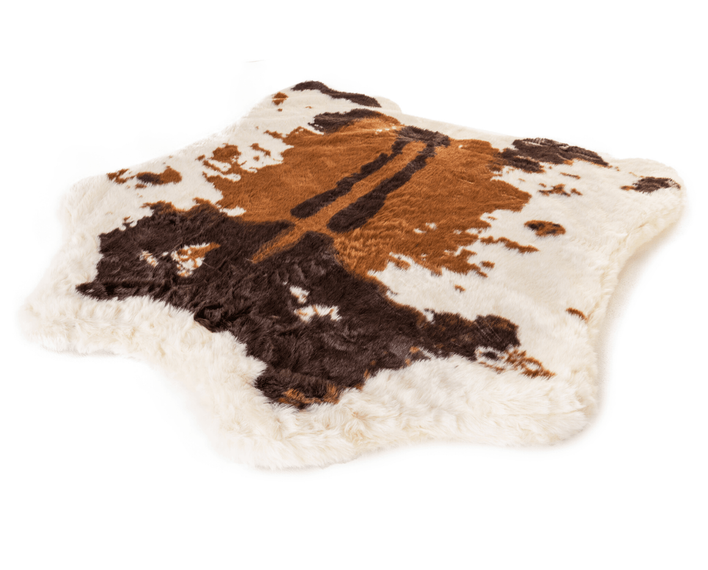 Cow print rug with brown and black patches on a white background