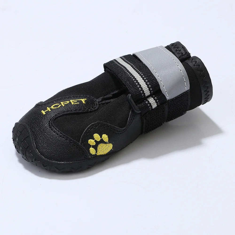 Black pet boot with yellow paw design and 'HCPET' branding on a light gray background