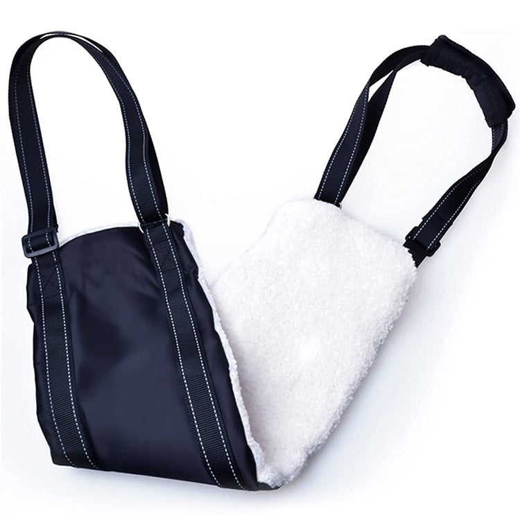 A navy dog sling with a white fleece padding on the back, featuring adjustable straps and a removable handle padding.