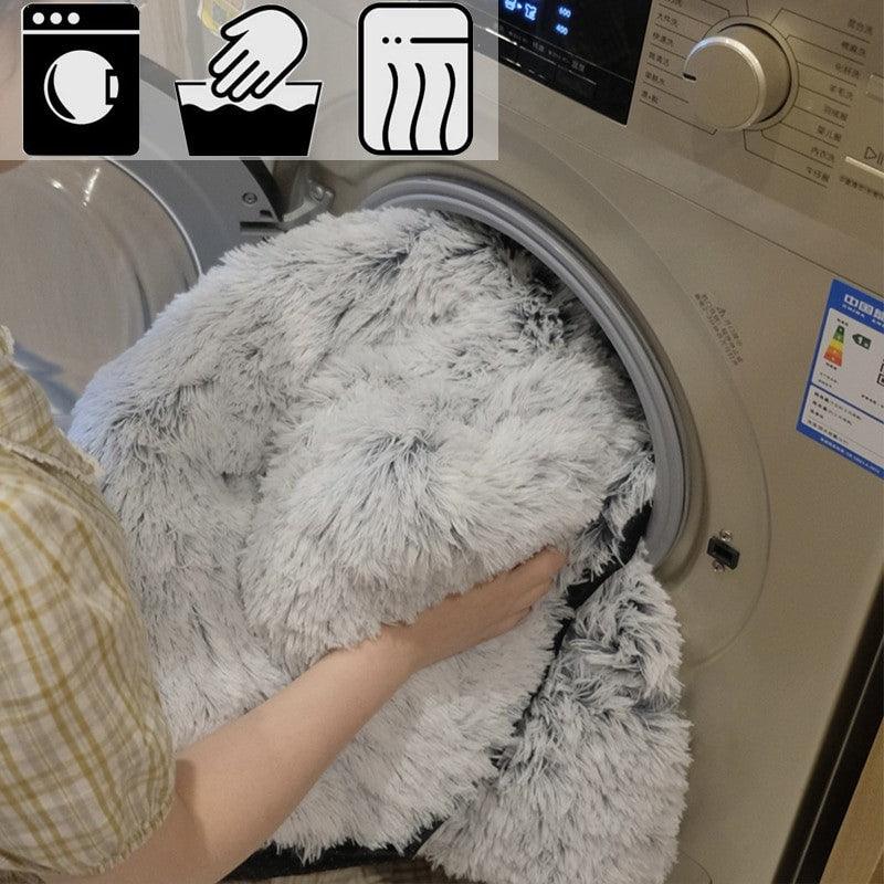 dog cover getting put into a washing machine