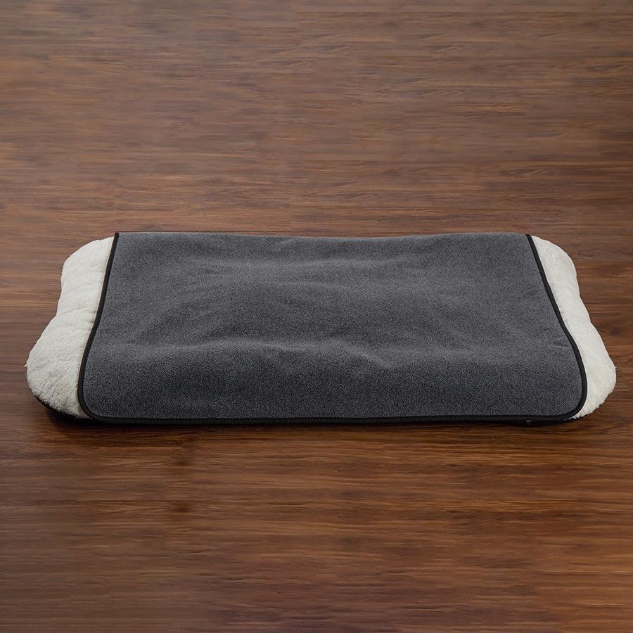 Dog Blanket and waterproof pad on small dog bed