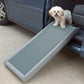 Small white dog on half ramp for dogs leaning on car